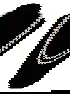 VINTAGE MIKIMOTO 18K GOLD CLASP PEARL NECKLACE: A vintage Mikimoto pearl necklace with a gold clasp. This elegant necklace showcases the timeless beauty and lustrous quality of Mikimoto pearls, known for their exceptional quality and shine. The pea