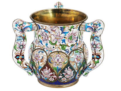 RUSSIAN 88 GILT SILVER AND ENAMEL THREE HANDLED CUP: A Russian gilt silver and enamel cup formed as a three handled loving cup decorated with shaded flower and foliage designs. The exterior is covered with multicolor enamel made in the cloisonne techniq