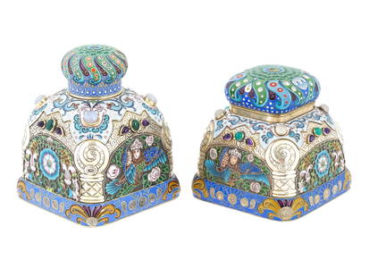 A PAIR OF LARGE RUSSIAN SILVER ENAMEL TEA CADDIES: A pair of large Russian silver enamel tea caddies with gemstones. The pieces are richly decorated with floral cloisonne enamel ornaments and images of mythical Sirin birds. The interior is gilt. The c