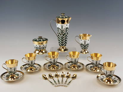 RUSSIAN SOVIET ERA STERLING SILVER ENAMEL COFFEE SET: A fine Russian Soviet era gilt sterling silver and enamel coffee service. Made circa 1970s. The service consists of 6 cups, 6 saucers, 6 spoons, 1 coffee pot, 1 sugar bowl and 1 creamer. All are ename