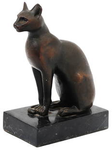 ANTIQUE 19TH C GRAND TOUR EGYPTIAN BRONZE CAT SCULPTURE: An antique Egyptian Grand Tour cast bronze sculpture representing a cat, circa 1880s. The cat is wearing an incised beaded collar with Eye of Horus pectoral, the ears pierced for earrings. The artwork