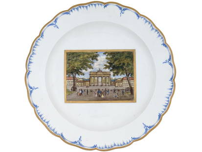 ANTIQUE KPM PORCELAIN CHARGER BRANDENBURGER TOR: An antique mid-19th century porcelain charger by KPM. The white plate has gilt rims with cobalt blue ornamental decor. The center of the plate bears a hand-painted picture depicting the Brandenburger