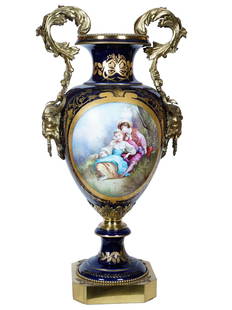 LARGE ANTIQUE FRENCH SEVRES PORCELAIN FLOOR VASE: A large antique 19th-century French porcelain floor vase. Baluster shape, cobalt blue ground color with gilt ornamental decor. The piece is garnished with hand-painted panels, a galant scene