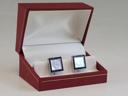 18K GOLD CHANNEL SAPPHIRES MOTHER-OF-PEARL CUFFLINKS: This stunning set of cufflinks crafted by the renowned DIF brand is a true masterpiece. Made of 18K white gold, these cufflinks boast a channel set of baguette sapphires and a mother-of-pearl center s