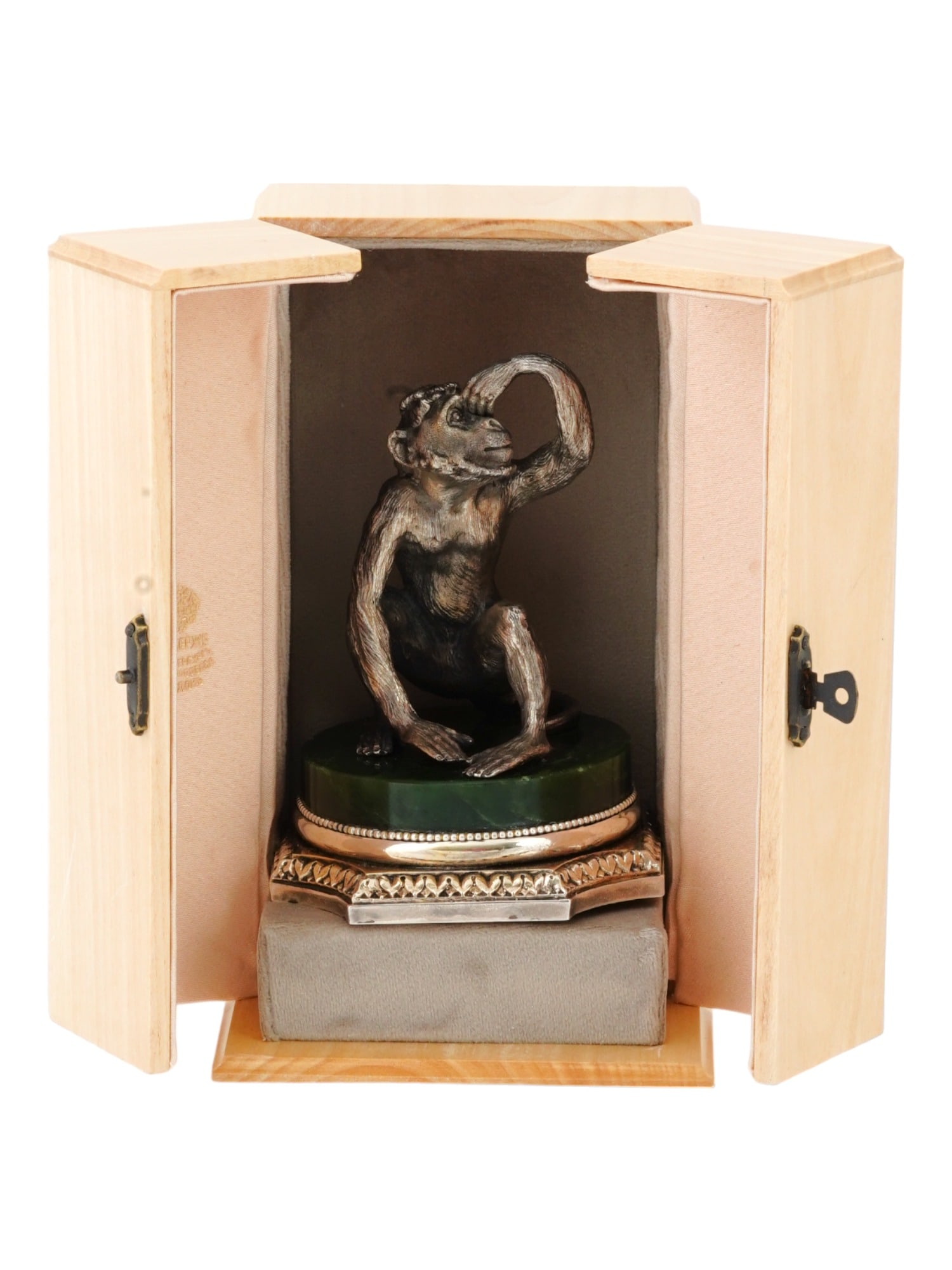 RUSSIAN SILVER MONKEY FIGURE ON A JADE STAND IOB: A fine Russian silver monkey figure on a silver and jade stand. The sitting monkey is created with great care and detail and represents an interesting, thoughtful and curious pose of the animal, raisi