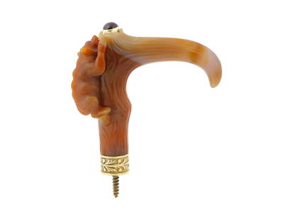 RUSSIAN SILVER GILT CARVED AGATE BEAR CANE HANDLE: A Russian cane handle is finely hand carved of natural agate in the form of a bear climbing a tree, the bear with gemstone eyes, most likely tourmalines, and the handle fitted with a large circular ca