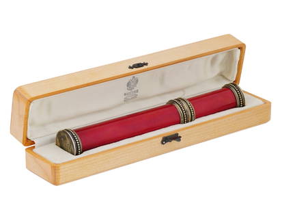 RUSSIAN GILT SILVER GUILLOCHE ENAMEL CIGAR CASE: A Russian gilt silver cigar case. The body of the case is covered with red guilloche enamel. The cap is decorated with an overlay Imperial eagle embellished with diamonds and central amethyst cabochon