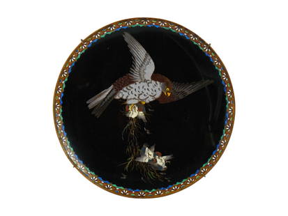 RARE ANTIQUE MEIJI JAPANESE CLOISONNE CHARGER PLATE: A rare antique Japanese Meiji era, enamel over copper charger plate. The exterior of the plate is adorned with a polychrome scene with an eagle and nestlings on black ground made in the Cloisonne tech