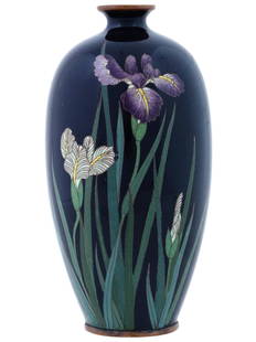 ANTIQUE JAPANESE MEIJI CLOISONNE ENAMEL FLOWER VASE: An antique Japanese copper vase with polychrome cloisonne enamel decor. Late Meiji period, before 1912. Ovoid shape with pronounced short neck. The obverse represents iris flowers against the cobalt