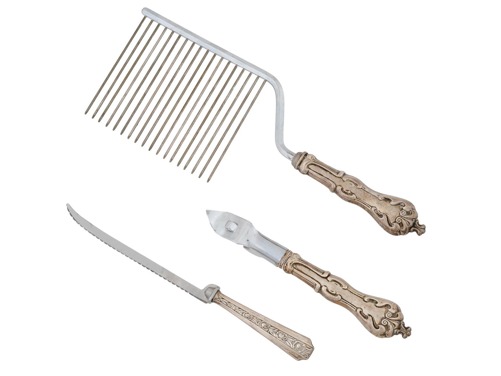 ANTIQUE AMERICAN WHITING STERLING SILVER CUTLERY: A lot of antique early 20th-century American sterling silver cutlery. A total of 3 items, a cake breaker, a can opener, and a citrus knife. Gilt embossed handles. Hallmark Frank M. Whiting Sterling is