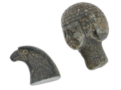 ANCIENT EGYPT STONE HEAD OF HORUS AND BUST FIGURES: A pair of ancient Egyptian hand-carved stone sculptures, the first represents the head of Horus and the second depicts a human bust with detailed facial features. Carved from stone and smooth to a pol