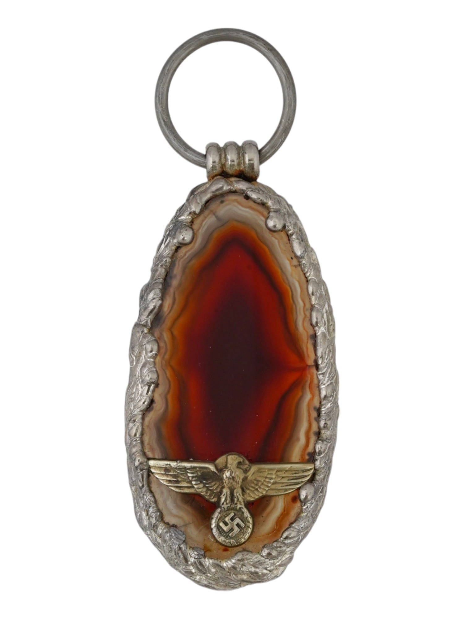GERMAN WWII MILITARY SILVER AGATE PENDANT: A World War II German jewelry pendant, a polished agate slab in silver alloy framing with overlay Reichsadler and swastika decor. Presumably custom made for a Waffen SS officers wife. Rare piece. Seco