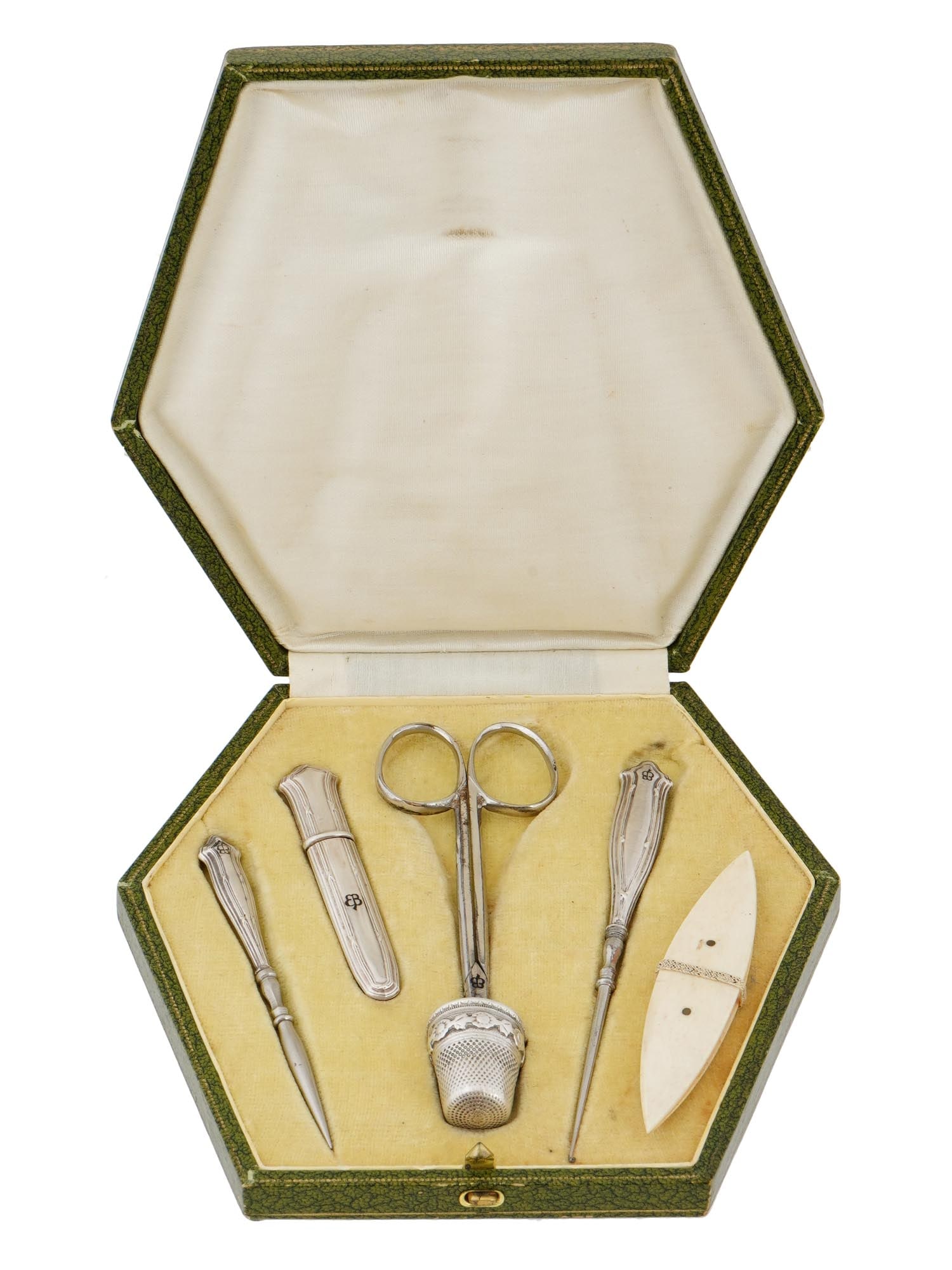 WWII EVA BRAUN MONOGRAMMED SEWING KIT IOB: A mid-20th century French sterling silver sewing kit in original box. A total of 6 items, including a pair of scissors, a needle case, two awls of various size, a tatting shuttle, and a thimble. Each