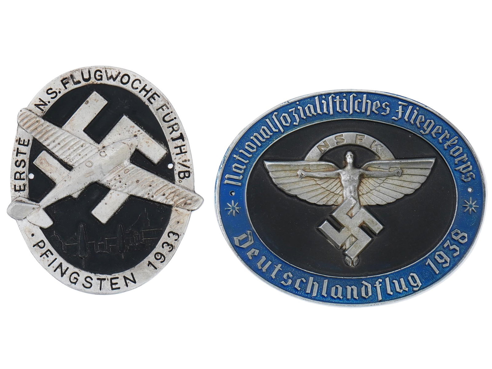 GROUP OF 2 NSFK PLAQUES 1933 1938 PILOTS COMPETITIONS: A lot of two rare WWII Nazi German Third Reich NSFK Pilots Championship plaques. The lot includes a 1933 Erste N.S. Flugwoche Furth I b Pfingsten, First N.S. Flight Week Furth I b Pentecost, featuring