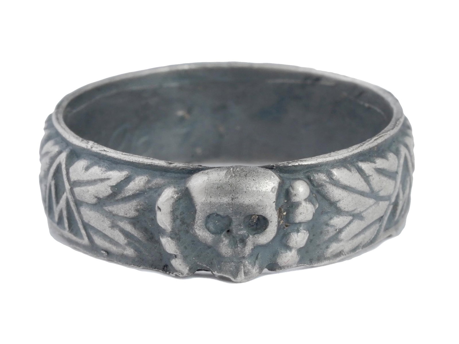 GERMAN WWII SS HONOR SILVER RING: A WWII Nazi German Third Reich SS Himmler Honor, probably Silver, ring. The exterior of the ring is engraved with oak leaves and swastika insignia patterns, and a Totenkopf swastika insignia in the ce
