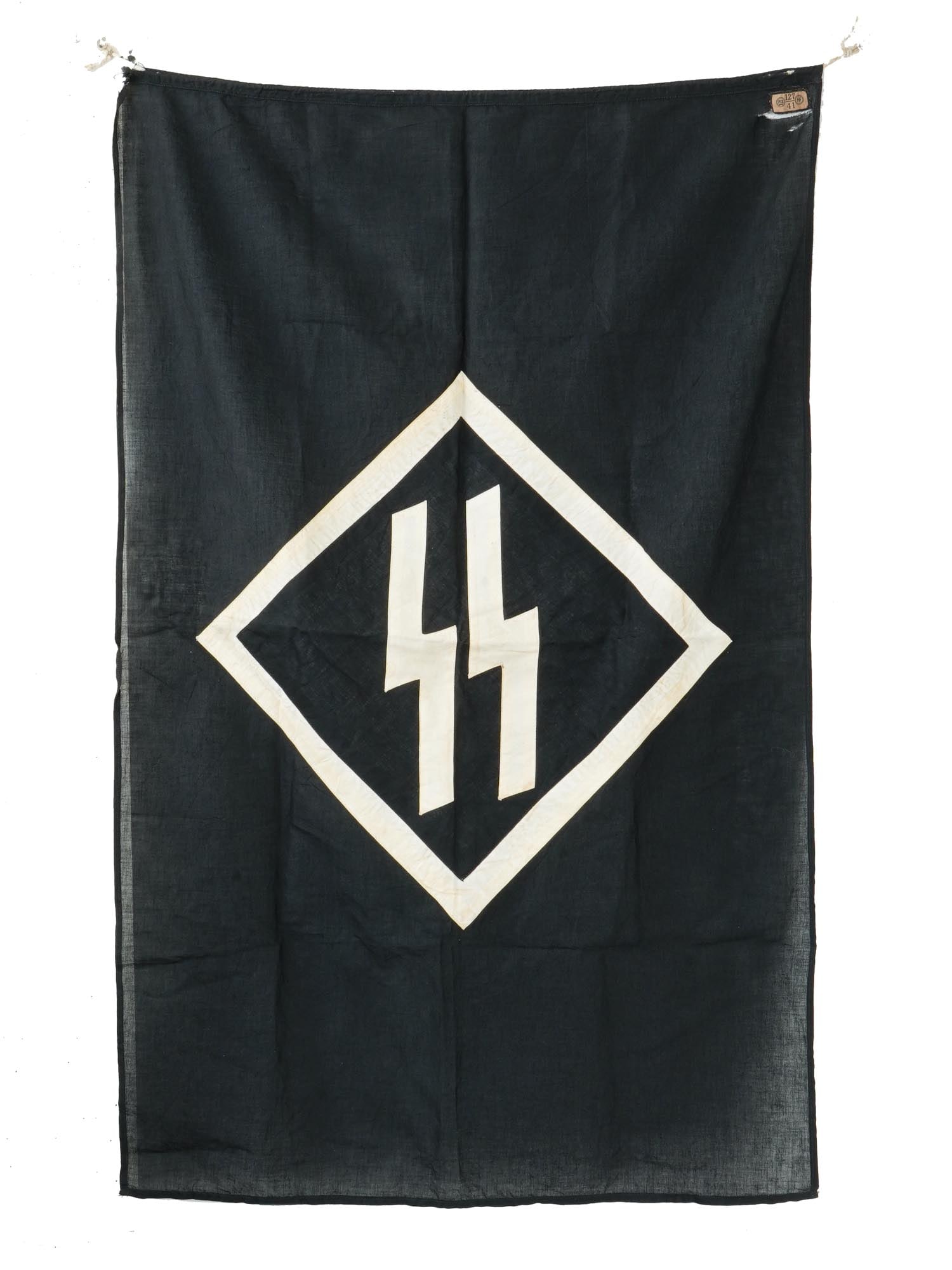 GERMAN WWII SS PODIUM BANNER: A WWII Nazi German Third Reich SS podium banner made of black cotton featuring double SS sig runes symbol inside a white diamond outline on the front side. Marked with a sewn label with RZM 127 41 SS