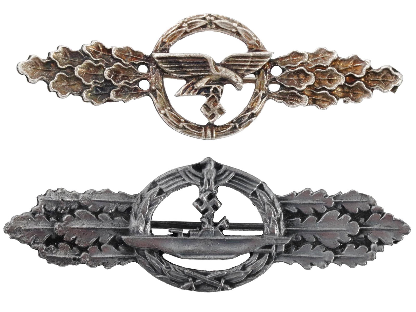 WWII NAZI GERMAN THIRD REICH MILITARY BADGES: A set of two German military badges from World War II. First is the front line submariner badge, a military award of Nazi Germany that existed in 1944 to 1945 and was awarded to the most experienced a