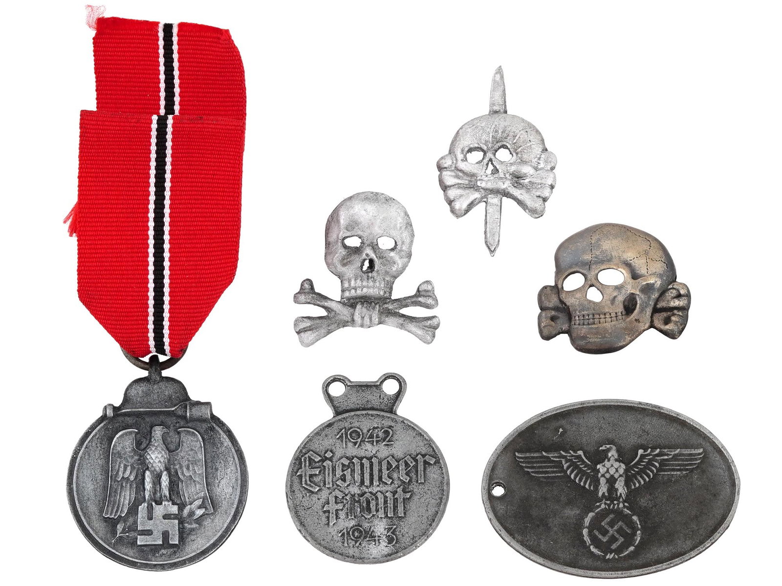 WWII NAZI GERMAN MILITARY DECORATIONS AND BADGES: A WWII Nazi German military history set including an Eastern Medal, officially known as the Winter Battle in the East 1941 to 1942 medal, symbolizing the harsh winter campaign, with a ribbon, a Gebirg