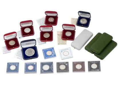 23 VINTAGE ISRAELI SILVER COINS AND MEDALS: A collection of 23 vintage Israeli silver coins and medals. This meticulously assembled set includes a diverse array of pieces, each with its own story and significance. Highlights include the Indepen