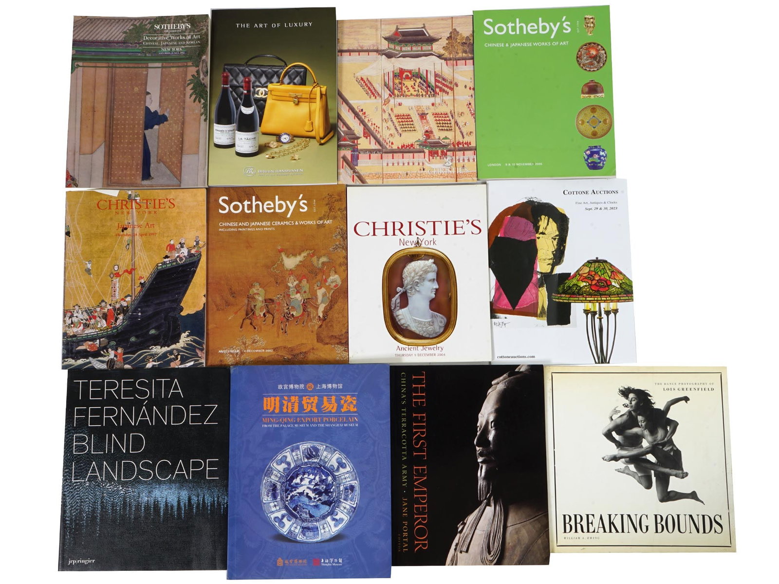 LOT OF CHRISTIES AND SOTHEBYS ART AUCTION CATALOGS: A collection of twelve auction catalogs, mostly Christies and Sothebys, covering a wide range of topics including Decorative Works of Art Chinese, Japanese and Korean, Chinese and Japanese Ceramics, A