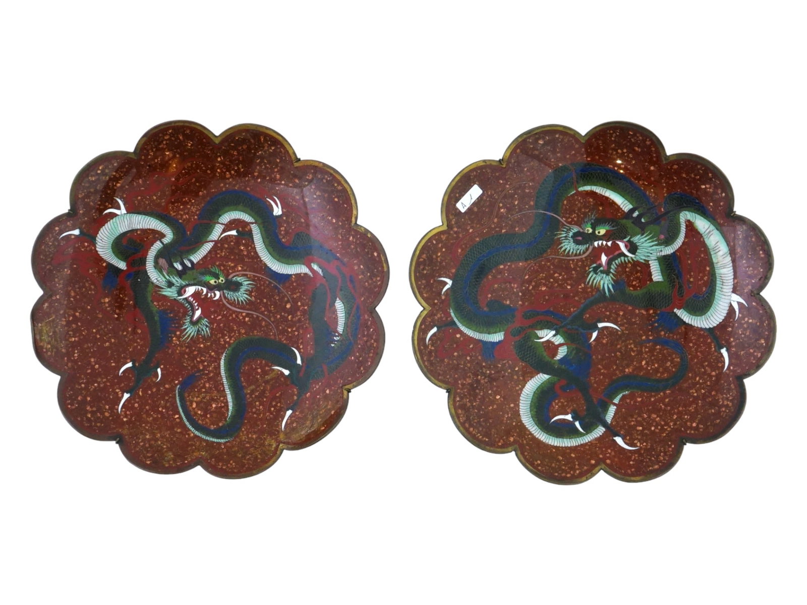 ANTIQUE JAPANESE CLOISONNE ENAMEL GOLDSTONE PLATES: A pair of antique Japanese cloisonne enamel and goldstone brass plates, Meiji era, 1868 to 1912. Each plate is enameled with a polychrome image of a dragon made in the Cloisonne technique on a goldsto