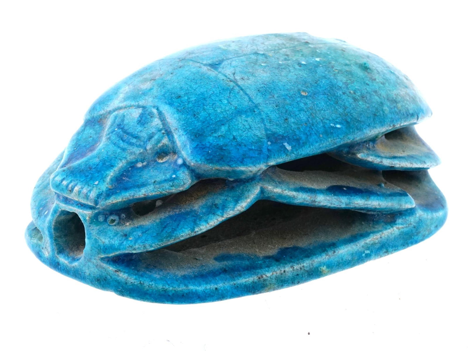 ANCIENT EGYPTIAN GRAND TOUR TURQUOISE HEART SCARAB: An ancient Egyptian carved turquoise Heart Scarab, from the Grand Tour period and adorned with hieroglyphics on the underside, holding immense historical and religious significance. Heart Scarabs were