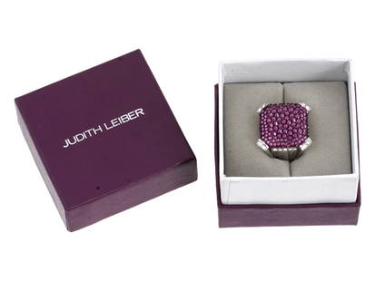 JUDITH LEIBER SWAROVSKI CRYSTAL PAVE COCKTAIL RING IOB: A vintage silver-tone statement ring by Judith Leiber. Pave style. Large square crown set with white and purple Swarovski crystals. Marked Judith Leiber inside. The item comes in original box. Judith