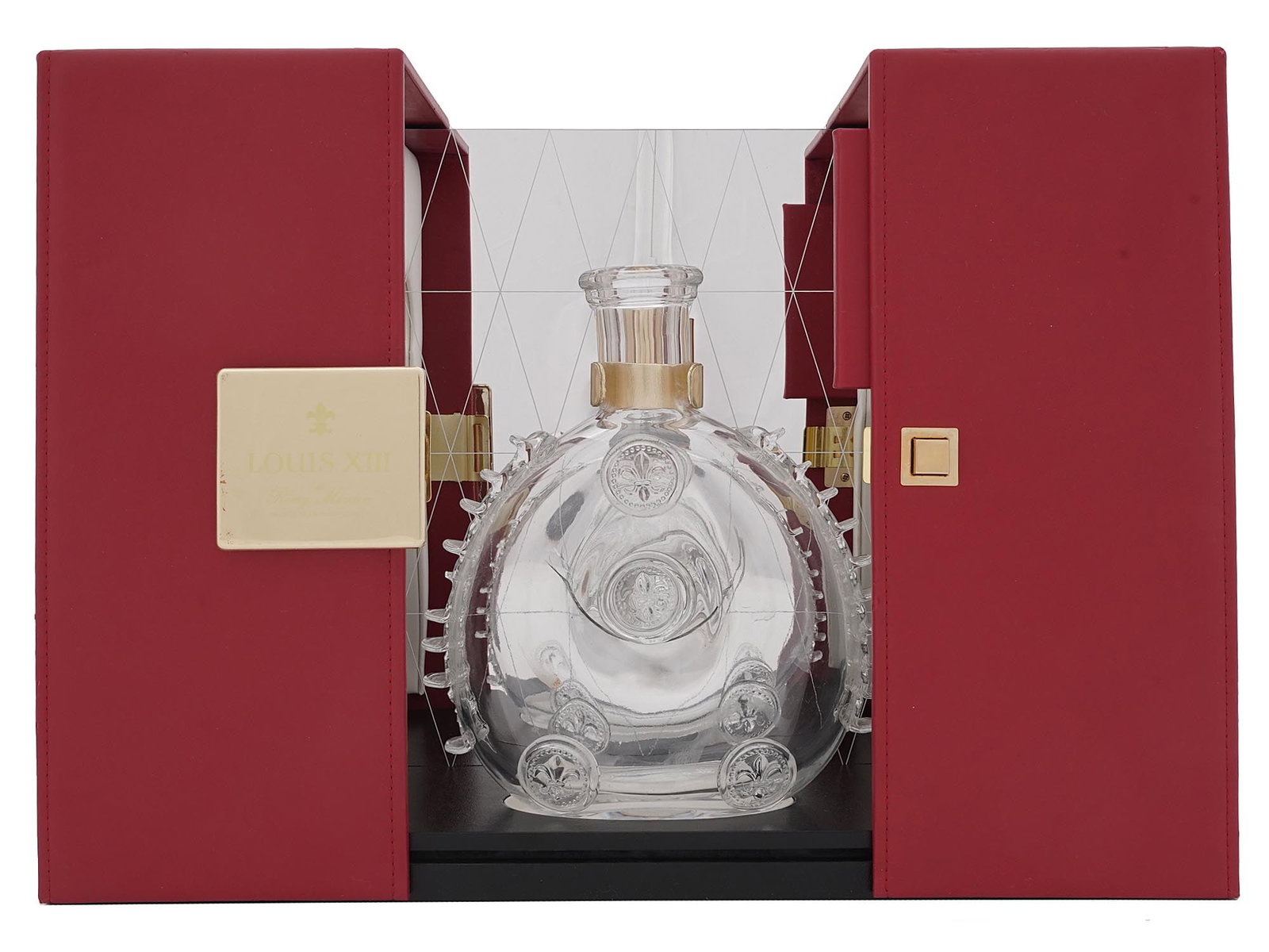 LOUIS XIII REMY MARTIN BACCARAT CRYSTAL DECANTER: A French Baccarat Remy Martin cognac Crystal Glass decanter. The decanter features a classic embossed Flur de Lis and ruffled patterns. Comes with a gilt and Flur de Lis clear crystal stopper.Marked w