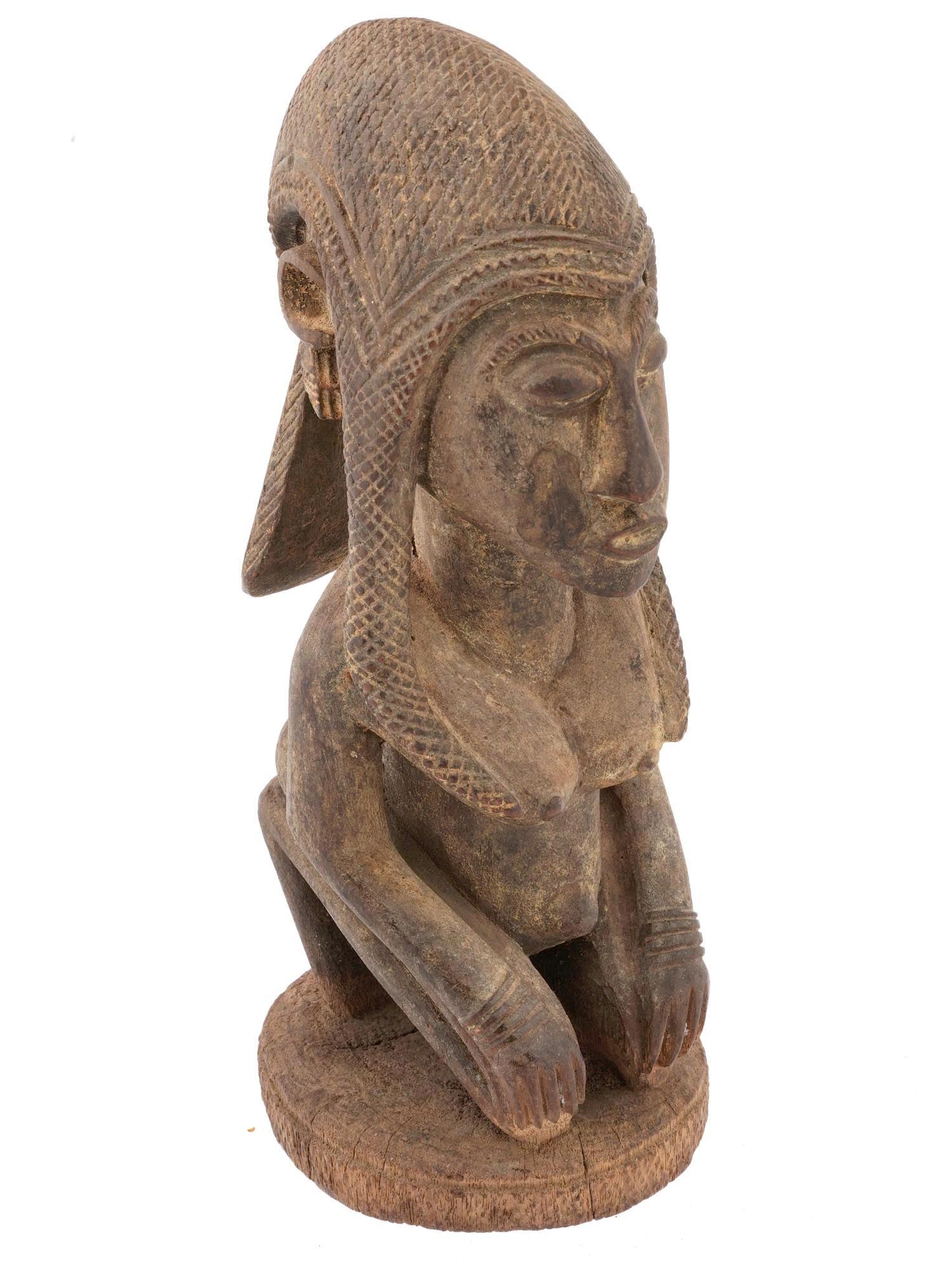 WEST AFRICAN DOGON MEDIUM FEMALE FIGURE FROM MALI: A West African medium female figure from the Dogon people in Mali representing a piece of traditional African art that is deeply rooted in the culture and spirituality of the Dogon community. Dogon ar