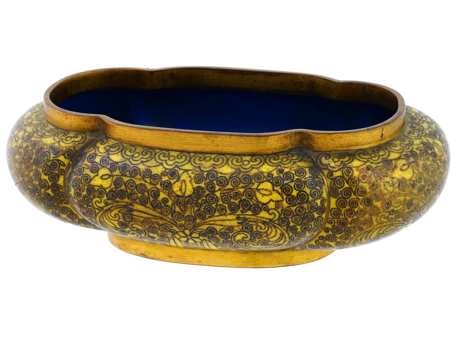 RARE ANTIQUE CHINESE YELLOW CLOISONNE ENAMEL BOWL: A rare antique Chinese enamel bowl. The bowl is made in a lobulated design. The exterior of the ware is enameled with yellow floral, foliage, and swirl motifs made in the Cloisonne technique. Unmarked