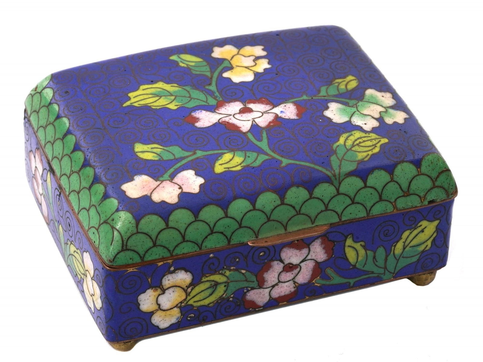 ANTIQUE CHINESE COVERED FLORAL CLOISONNE ENAMEL BOX: An antique Chinese covered enamel over brass jewelry or trinket box. The box is enameled with polychrome images of blossoming flowers surrounded by foliate scroll and geometrical ornaments made in the