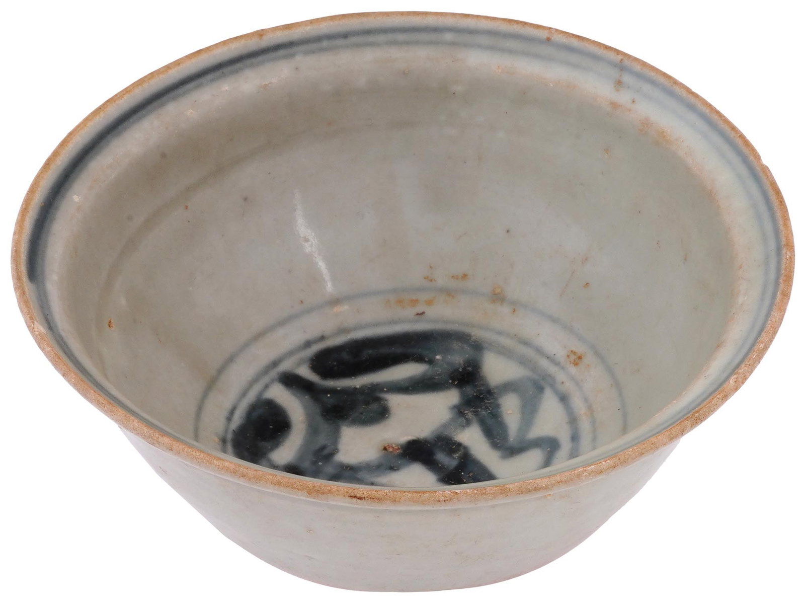 ANTIQUE CHINESE MING DYNASTY SWATOW CERAMIC BOWL: An antique Chinese, Ming Dynasty, Swatow ceramic bowl. The bowl is covered with enamel in a white shade. The interior is covered with cobalt blue ornaments. Circa: 17th century. Swatow ware or Zhangzh
