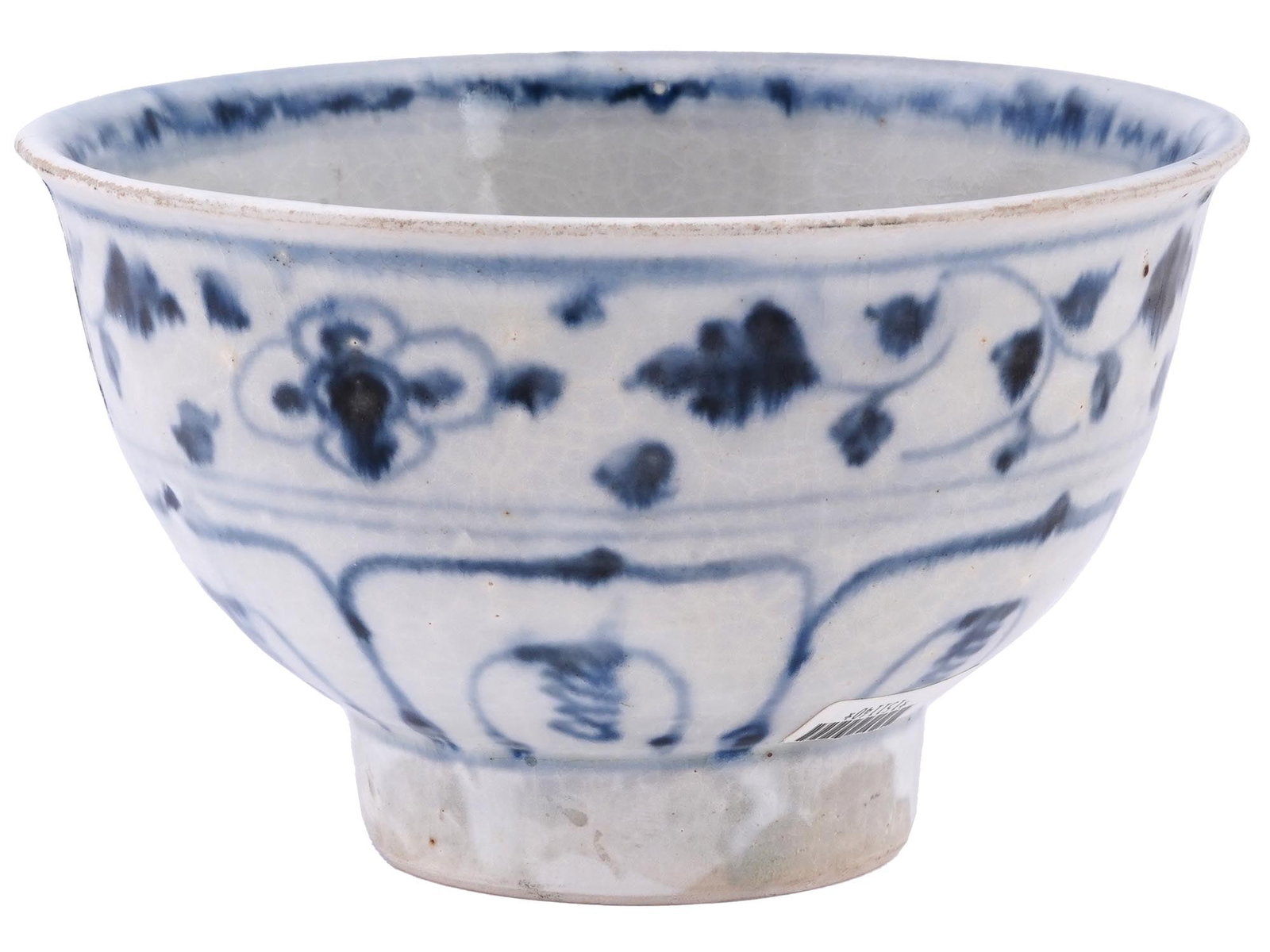 ANTIQUE VIETNAMESE HOI AN HOARD GLAZED CERAMIC BOWL: An antique Vietnamese Hoi An Hoard ceramic bowl. The exterior of the bowl is adorned with hand enameled cobalt blue underglazed scrolling floral and foliage ornaments, raised on a low pedestal. The in
