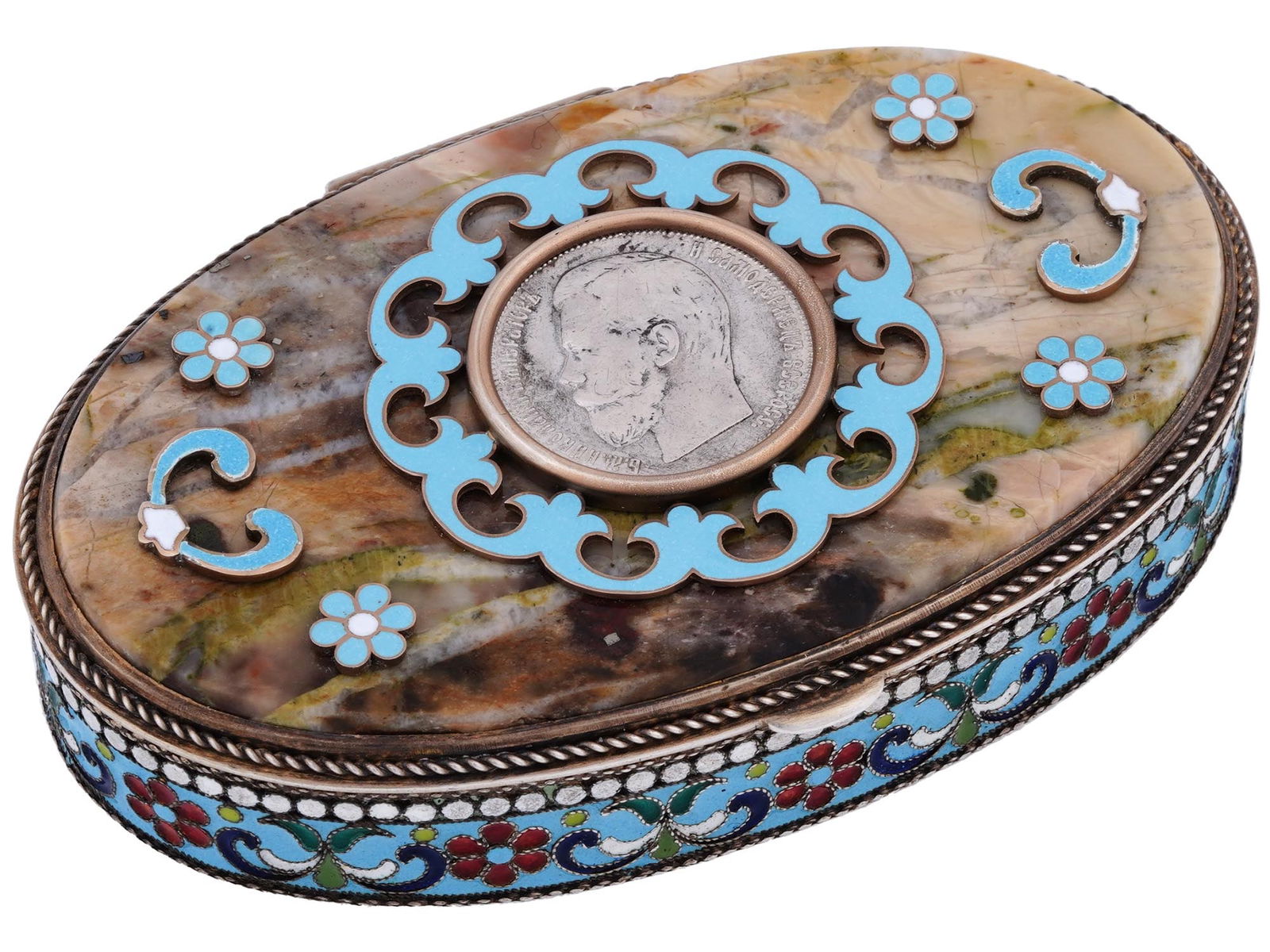 RUSSIAN GILT SILVER ENAMEL TRINKET BOX WITH COIN: A Russian gilt silver trinket or pill box. Oval shape, hinged lid set with polished marble. The box is garnished with floral cloisonne enamel decor. A One Ruble coin with the last Russian emperor Nich