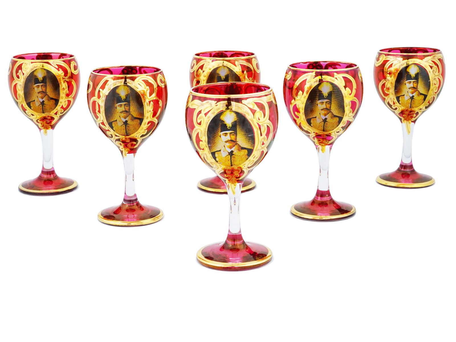PERSIAN QAJAR STYLE PAINTED GLASS WINE GOBLETS SET: A set of vintage clear and red glass wine goblets. A total of 6 items. The pieces are decorated with transfer-printed male portrait medallions and hand-paintedo rnaments inspired by the Qajar era of P