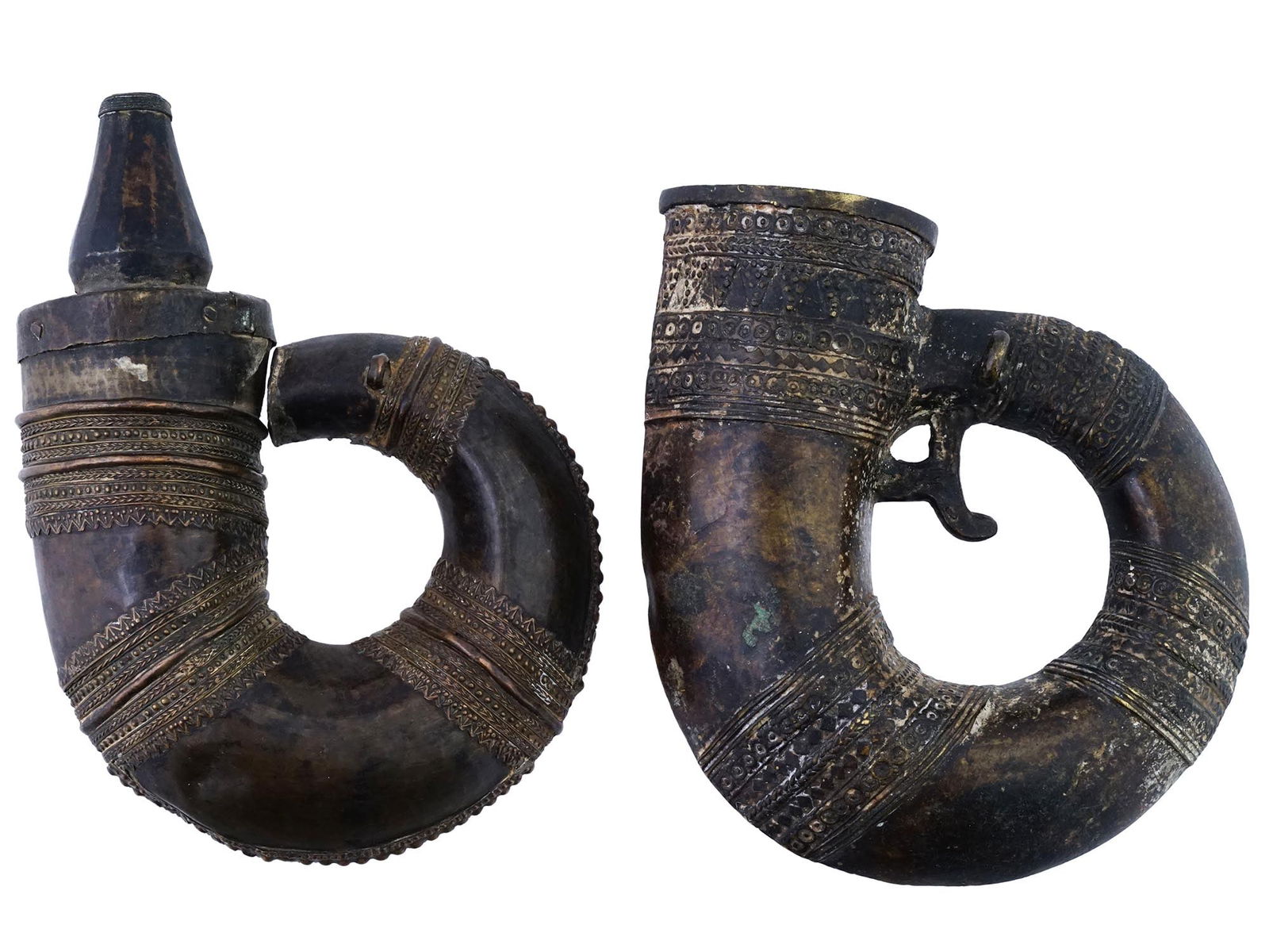 ANTIQUE OTTOMAN EMPIRE BRONZE GUN POWDER FLASKS: A pair of antique 18th to 19th century Ottoman cast bronze gun powder flasks. Figurative horn shape, embossed ornamental design. Fitting rings on the sides. Collectible Militaria And Historical Relics