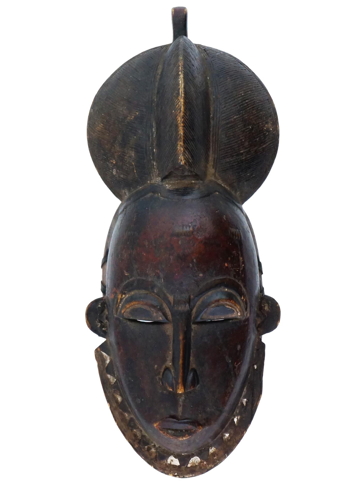ANTIQUE AFRICAN BAULE TUNTUM HAND CARVED WOOD MASK: An antique Central African Baule Tuntum hand craved mask. The mask is modeled with narrow eyes, a small mouth, a wide collar that completely covers the neck, and a headdress. Tuntum in the Akan langua