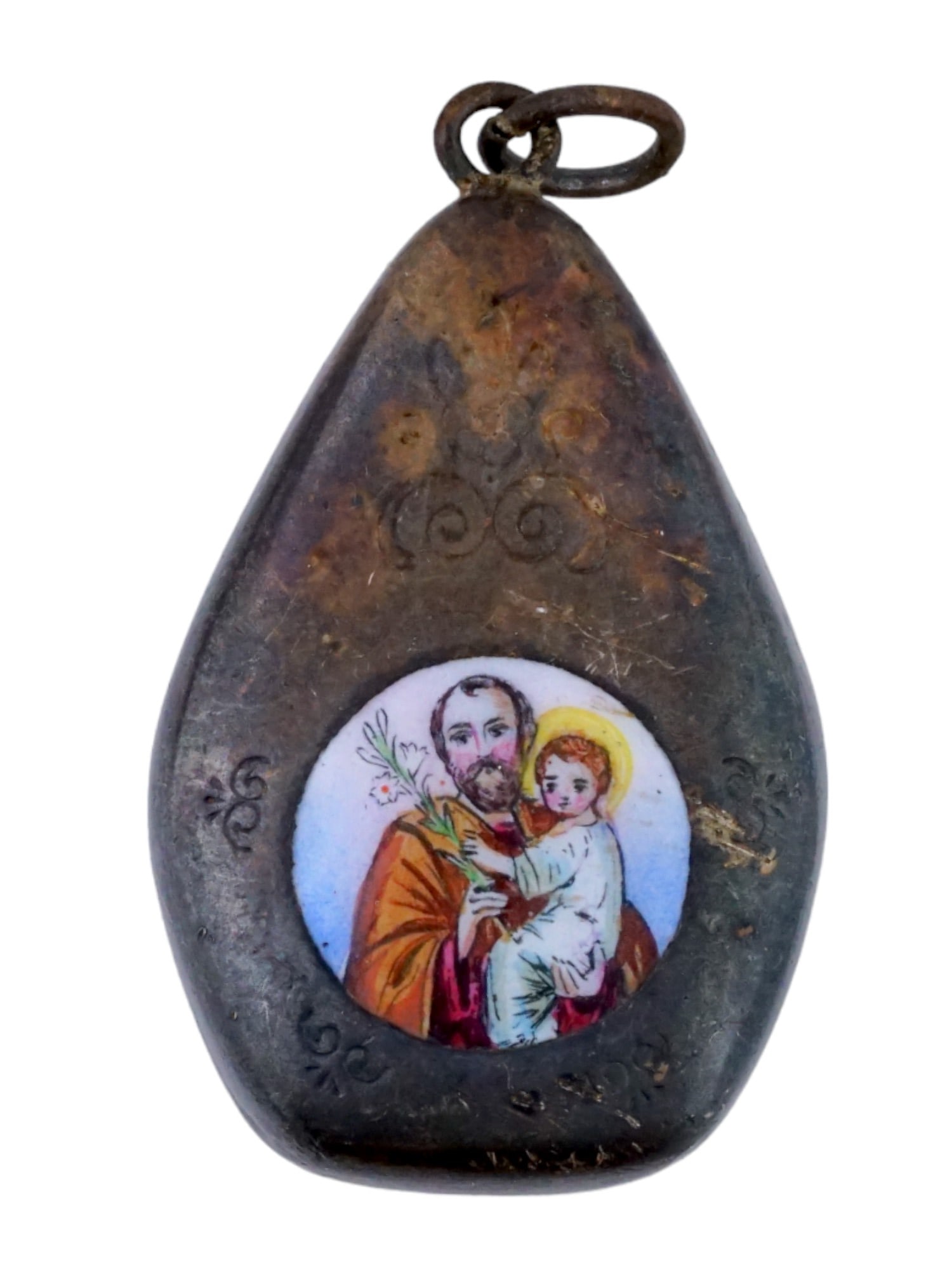ANTIQUE ARGENTINIAN SILVER ENAMEL RELIQUARY PENDANT: An antique Argentinian silver reliquary pendant. Its design, resembling a drip, adds a distinctive touch to its overall aesthetic. The enamel picture on the front depicting the image of Jesus babe wit