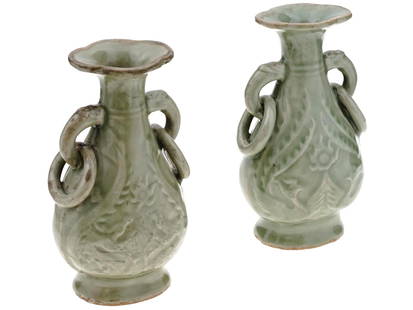 ANTIQUE CHINESE LONGQUAN CELADON CERAMIC VASES: A pair of antique Chinese moulded Longquan celadon ceramic vases. Presumably late Ming dynasty, before 1644. Pear-shaped body with pronounced base and flared rims, two side handles with decorative