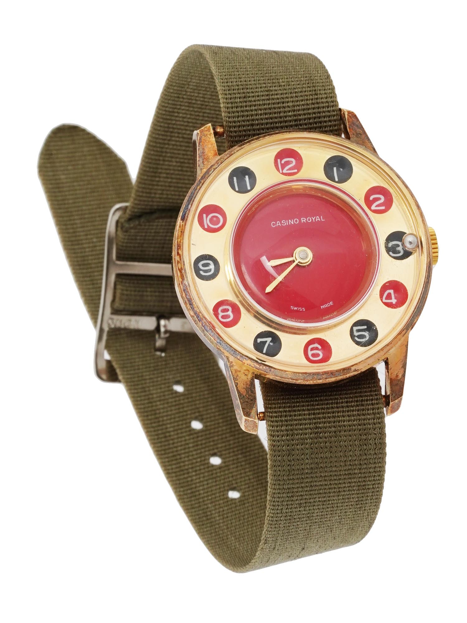 VINTAGE SWISS CASINO ROYAL WRIST WATCH F 1970S: A vintage Swiss wristwatch with manual winding from the 1970s Casino Royal. The watch case is gold toned, the dial is stylized as a casino roulette with Arabic numerals on alternating red and black ro