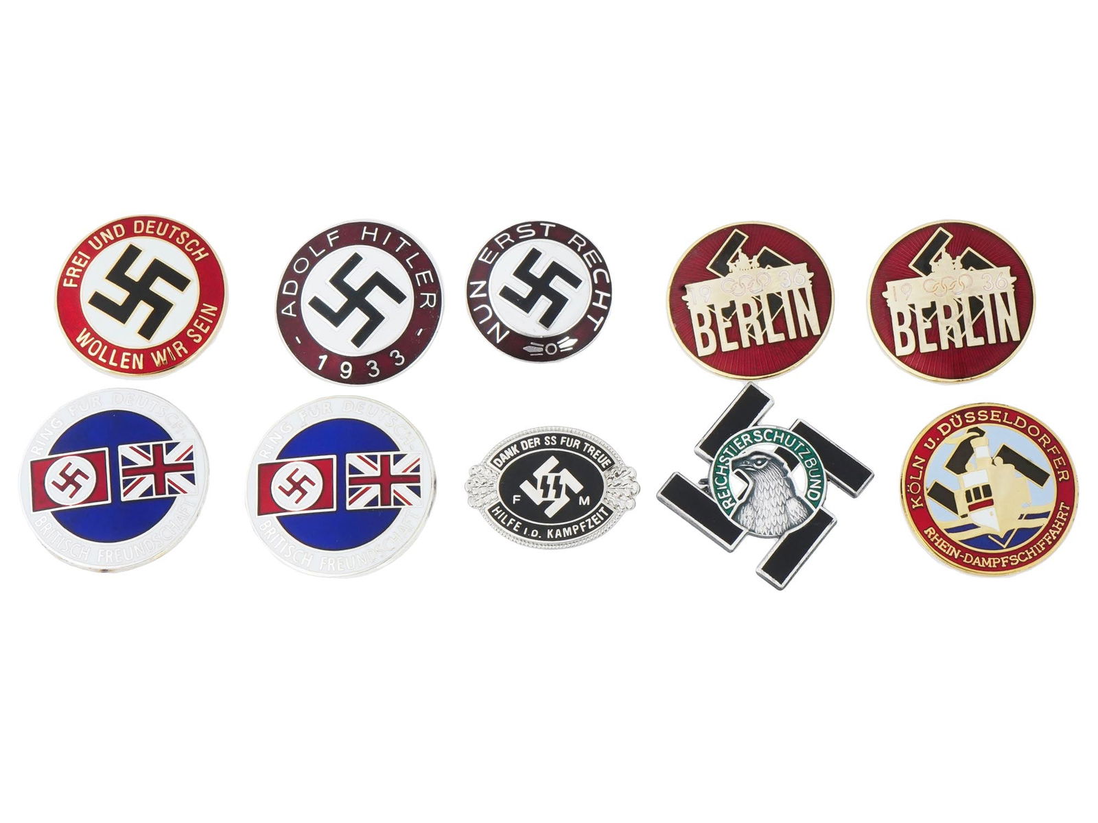 GROUP OF TEN PRE WWII NAZI GERMAN PINS: A group of ten Pre WWII Nazi German pins, including a NSDAP Frei Und Deutsch Wollen Wir Sein pin, a 1933 Adolf Hitler pin, 1936 Berlin Summer Olympic Games pins, German British Friendship pins, a Koln