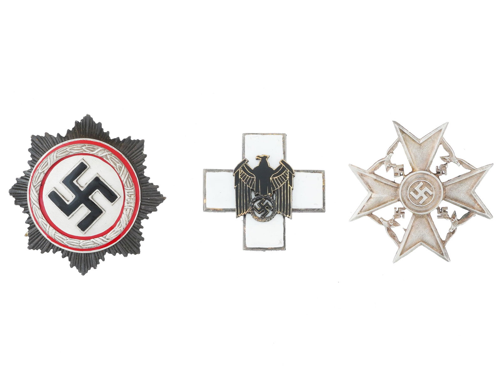 NAZI GERMAN SPANISH AND GERMAN CROSS AWARD BADGES: A lot of three WWII era Nazi German military decorations. Spanish Cross award badge in silver without swords, marked RZM SS 215 41 on the backside. German Social Welfare badge of second class. Order o