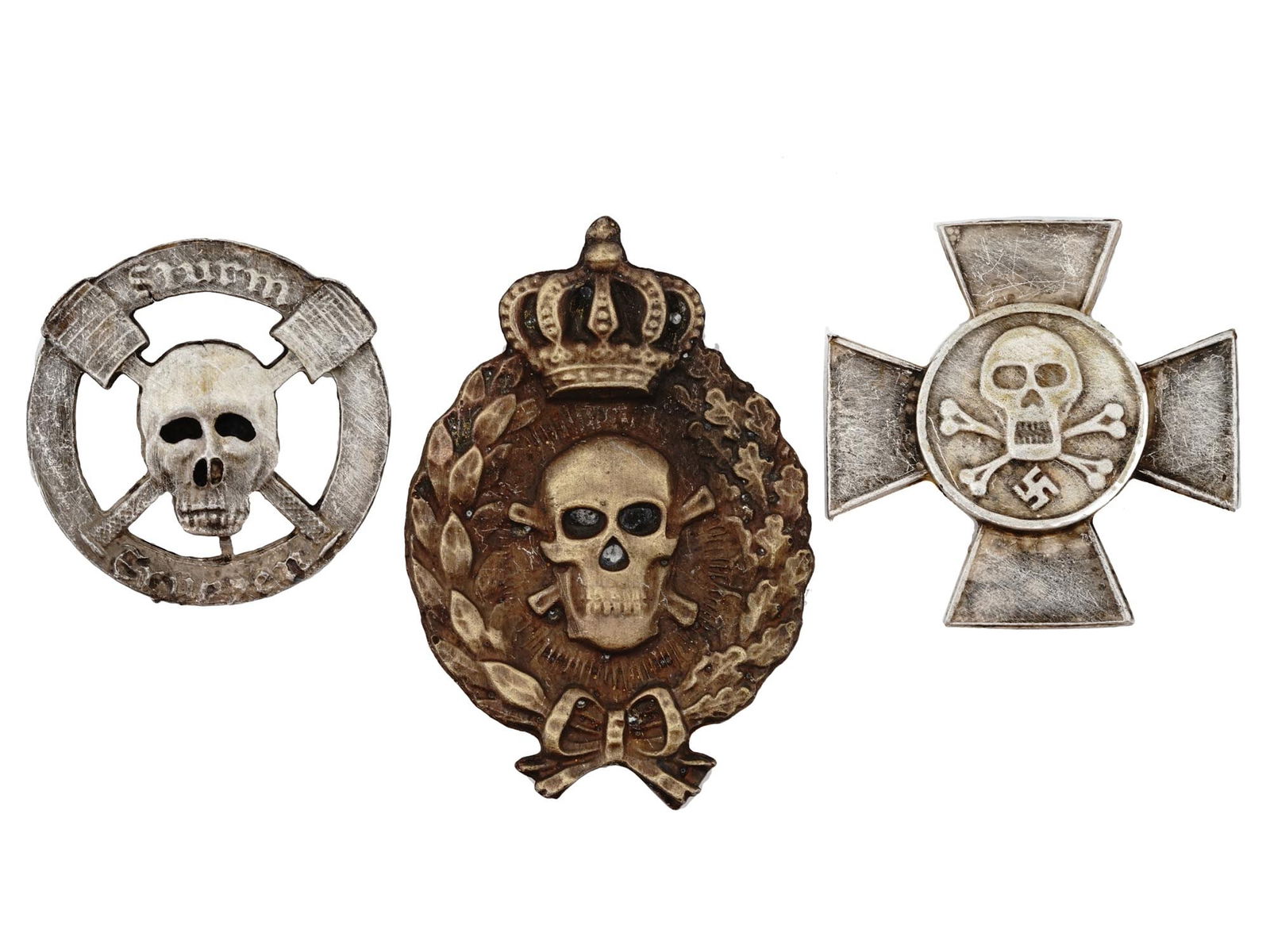 WWI AND WWII NAZI GERMAN STORMTROOPER CROSS BADGE: A pair of WWI and WWII German military awards. The first: a pair of WWI German Imperial stormtrooper badges including one featuring a skull and crossbones wrapped in oak and laurel wreath and topped w