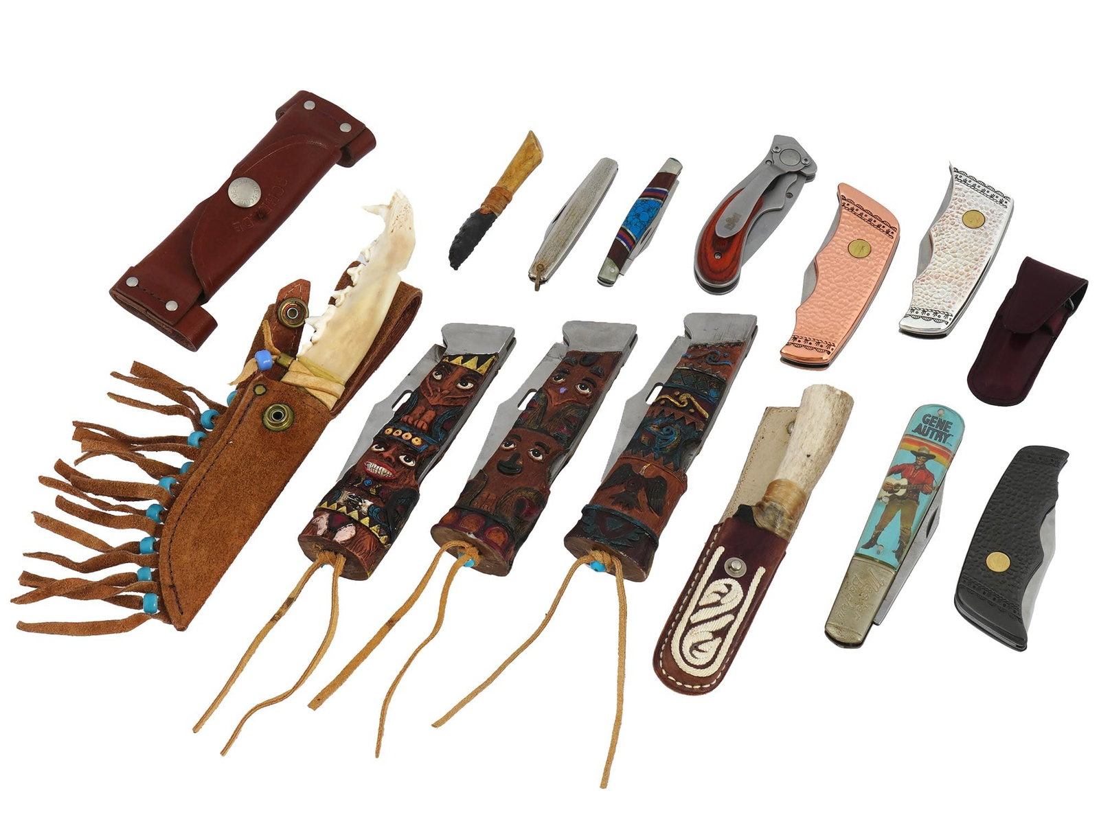 VINTAGE POCKET KNIVES OF VARIOUS DESIGNS: A huge lot of vintage knives, encompassing traditional pocket knives, intricately crafted pieces featuring carved wood painted handles, and knives created by Franklin Mint with ornate decorated cases.