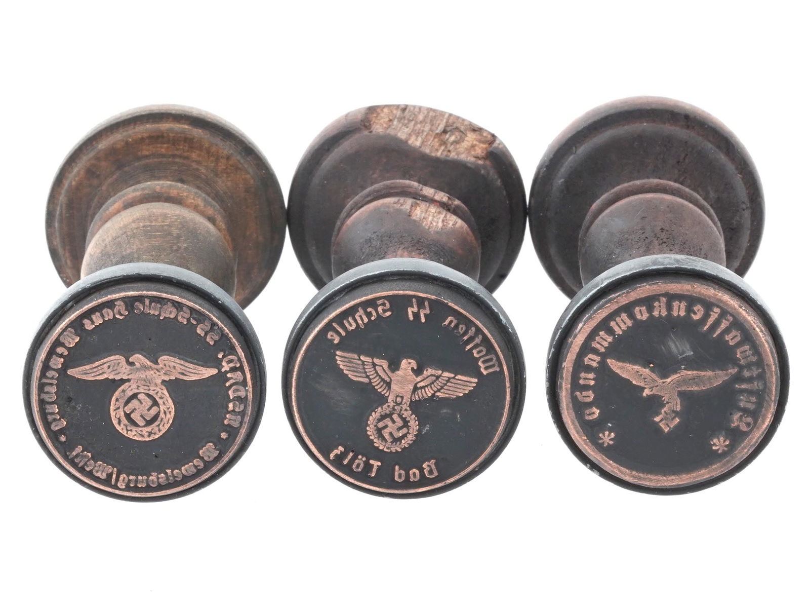 GROUP OF THREE WWII NAZI GERMAN SS HAND INK STAMPS: A group of three WWII Nazi German wood and metal ink hand stamps including a stamp for the Luftwaffe, a stamp for the Waffen SS School, and a stamp for the NSDAP SS School. Second World War Nazi Germa