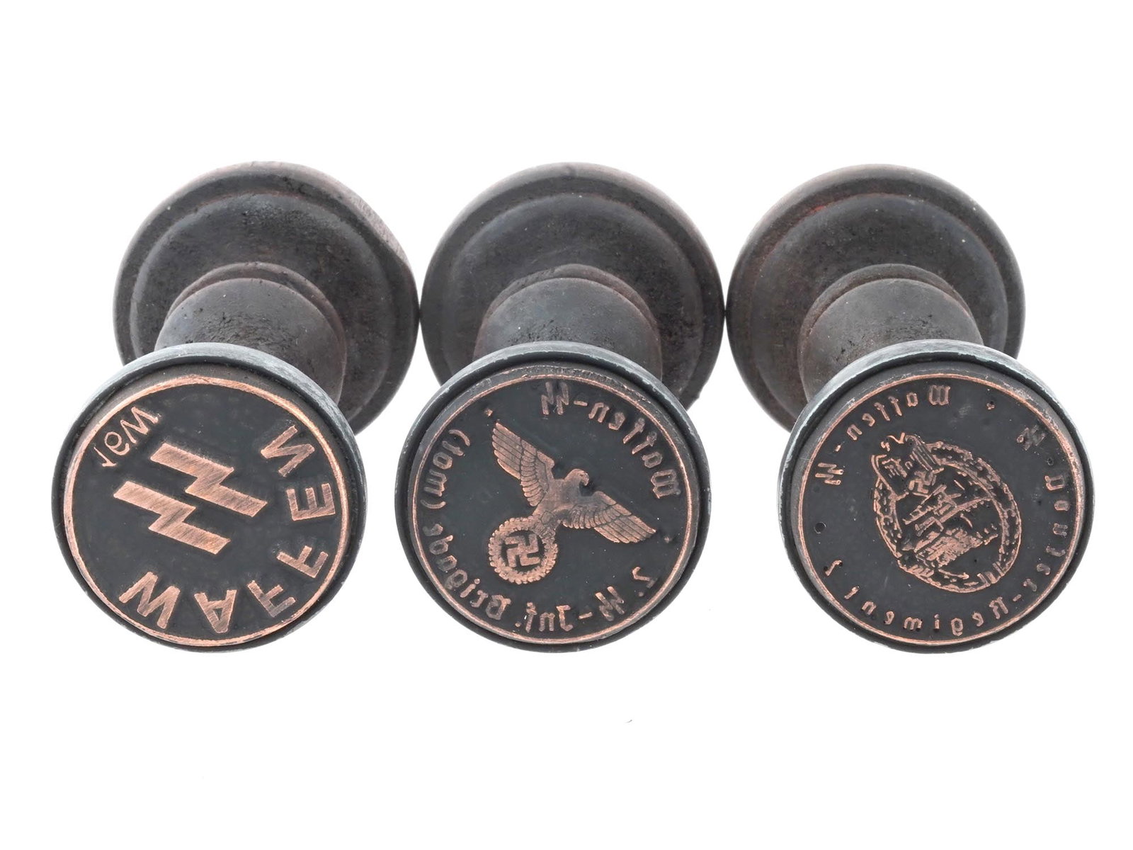 GROUP OF THREE WWII NAZI GERMAN SS HAND INK STAMPS: A group of three WWII Nazi German Waffen SS wood and metal ink hand stamps including a stamp for the Waffen SS, a stamp for the Waffen SS 5th Infantry Brigade, and a stamp for the Waffen SS Panzer Reg