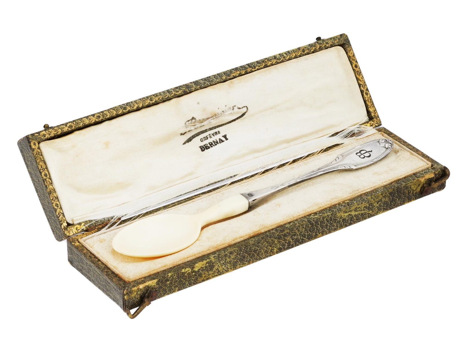 GERMAN WWII SILVER SPOON EVA BRAUN LOGO IN BOX: A World War II French Sterling Silver spoon. The handle is decorated with an engraved foliage ornament, and engraved initials EB referring to Eva Braun, 1912 to 1945, an office assistant and model who