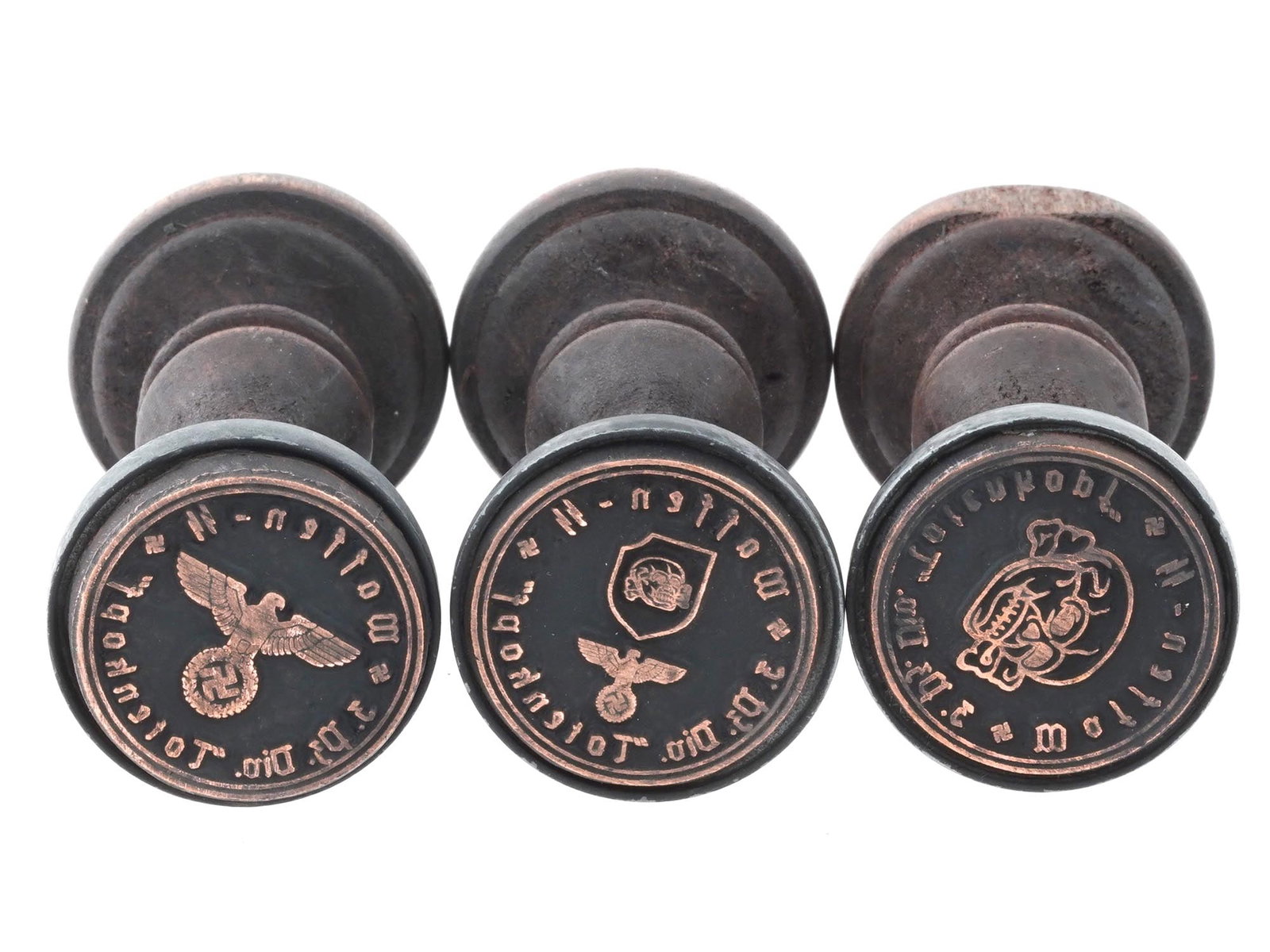 GROUP OF THREE GERMAN WWII WAFFEN SS HAND STAMPS: A lot of three World War II Nazi German wooden seals of Waffen SS Division Totenkopf. The 3rd SS Panzer Division Totenkopf was an elite division of the Waffen-SS of Nazi Germany during World War II, s