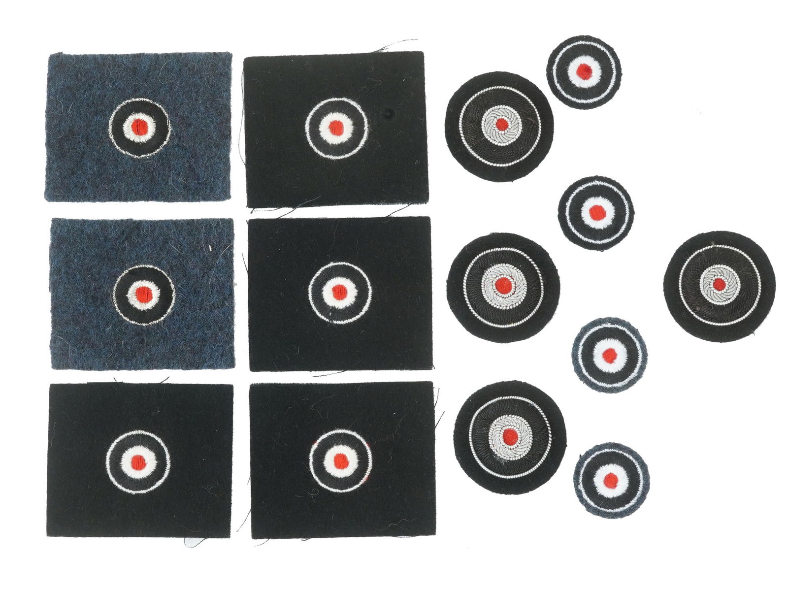WWII NAZI GERMAN WEHRMACHT CAP PATCHES 14 ITEMS: A large collection of Nazi Germany fabric patches, a total of 14 items. Wehrmacht cap patches of different sizes feature a red round dot in a double outline of white and black. Nazi German Collectible