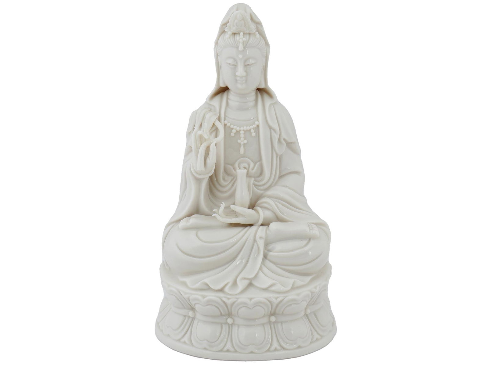 VINTAGE TOZAI GLAZED PORCELAIN FIGURINE OF GUANYIN: A vintage glazed white porcelain figurine. The piece represents Guanyin, a Chinese Bodhisattva associated with compassion. The goddess is depicted sitting ?ross-legged on a lotus throne with a vase in